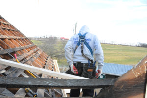 PJ's roofing employee working on Metal Roof Construction