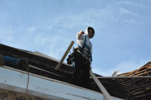 PJ's roofing employee working on Metal Roof Construction