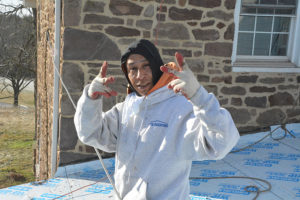 PJ's roofing employee posing during Metal Roof Construction project
