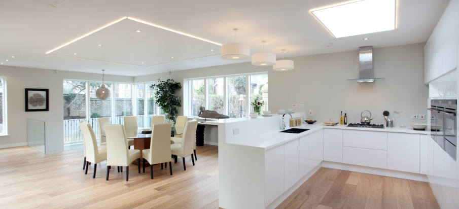 large modern kitchen with a skylight above the appliances