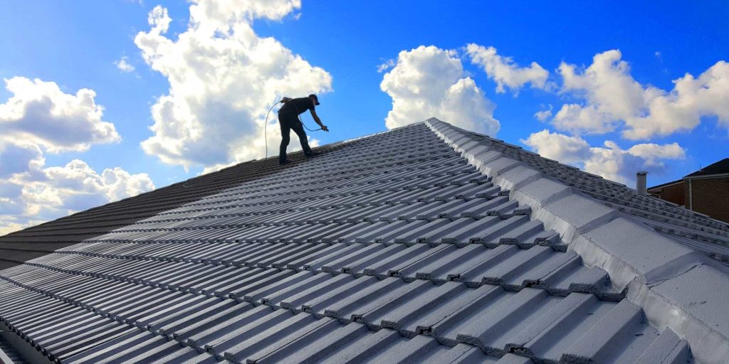 man on residential slate roof