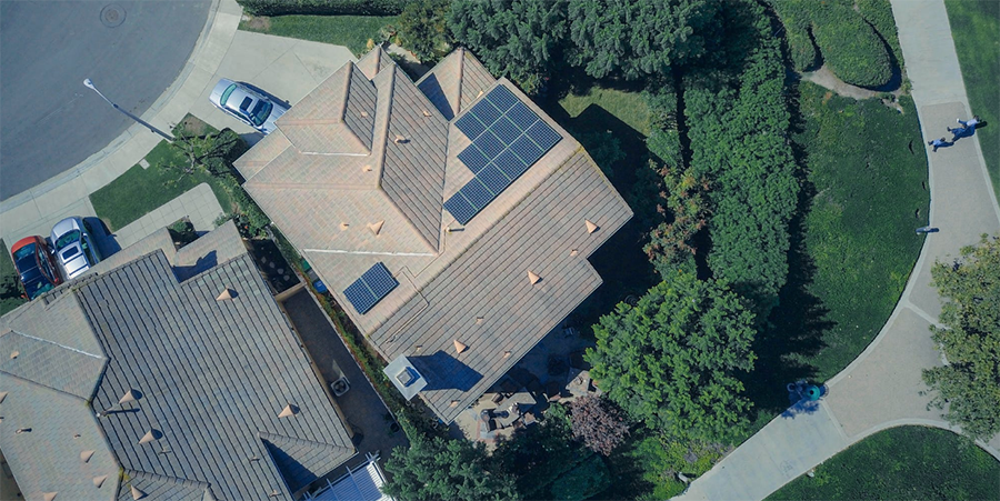 drone view of roof with solar panels