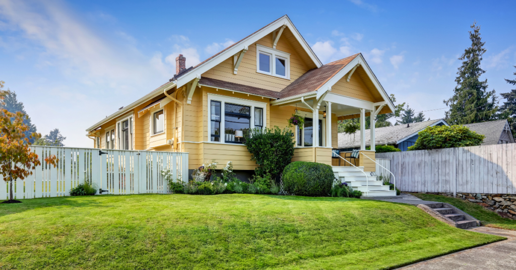 yellow house with a brown roof