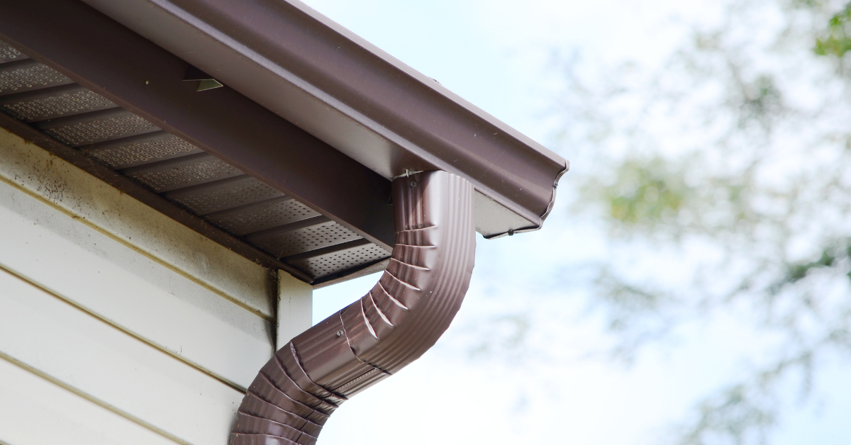 residential home with brown metal gutter and downspout