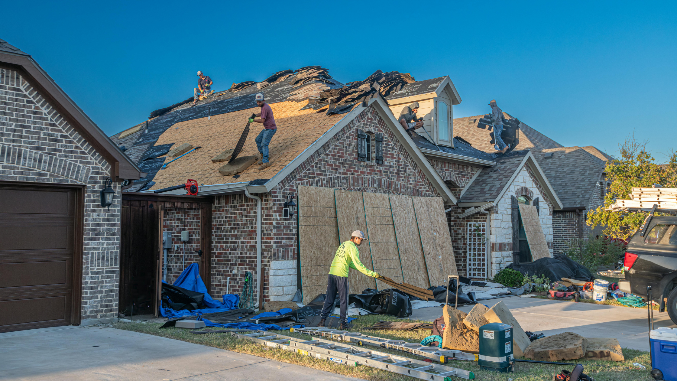 The PJ's Roofing team replacing a UV damaged roof.